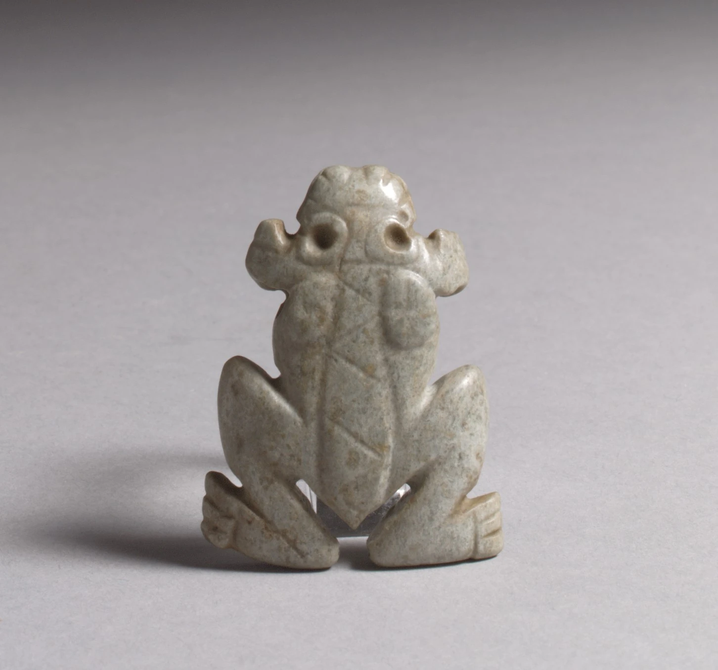 Finished jadeite frog pendant with carved contours