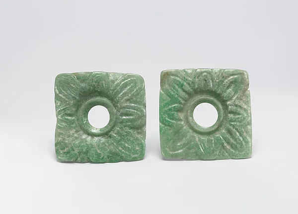 Pair of finished jadeite earflare frontals with smooth circular surfaces